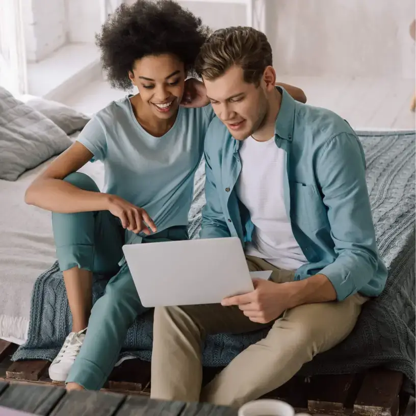 Couple with laptop choosing health insurance