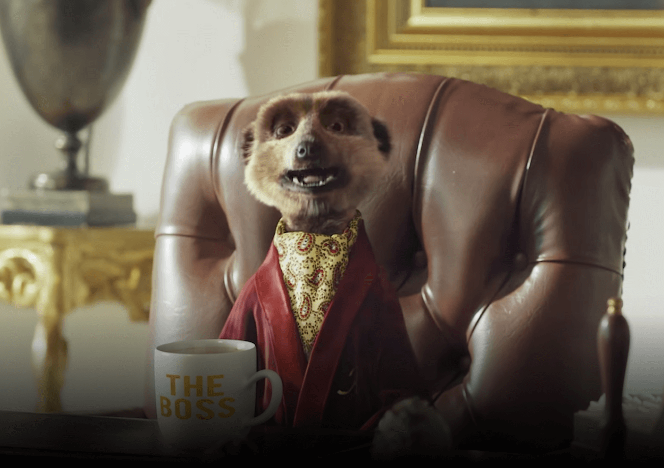 Aleksandr sitting in leather chair in living room with a coffee cup